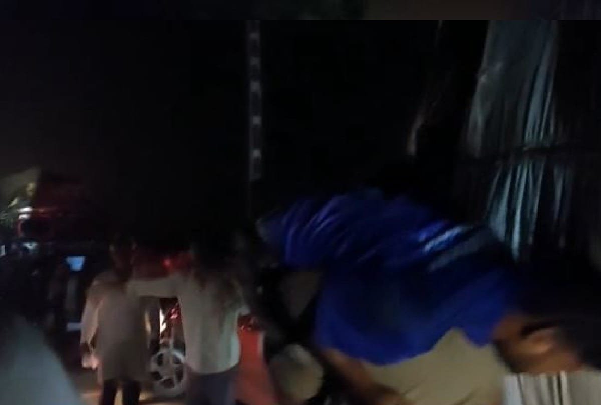 policeman running with carrying the injured man on his shoulder and saves his life
