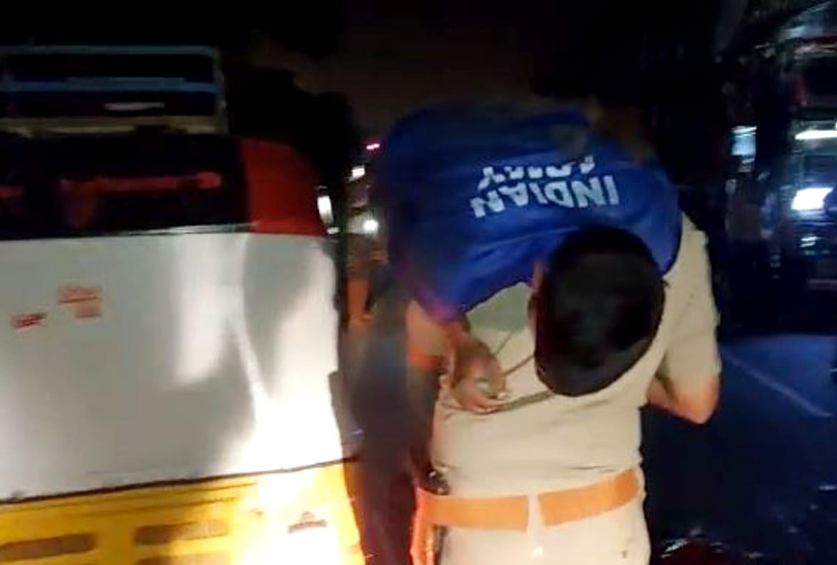 policeman running with carrying the injured man on his shoulder and saves his life