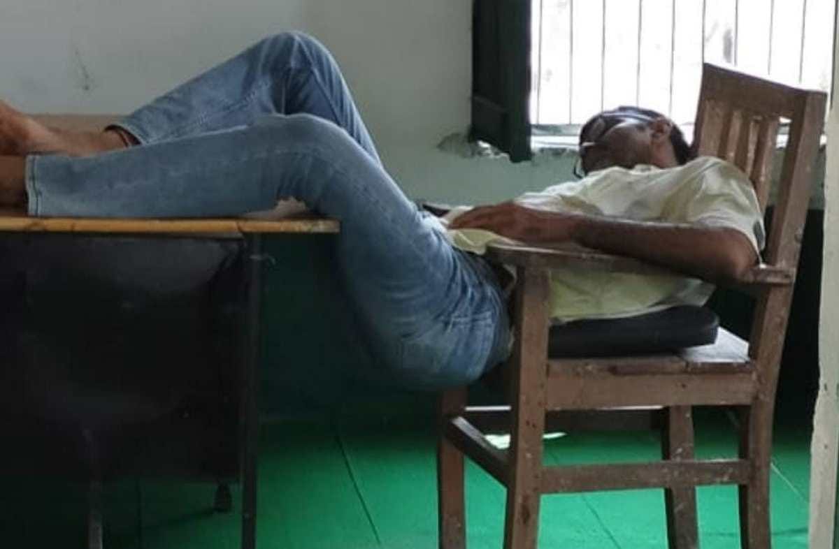 Headmaster suspended after photo of sleeping on chair went viral 