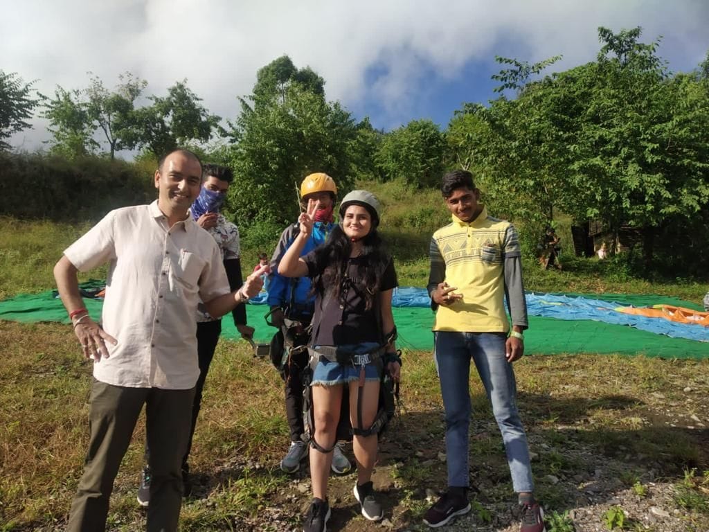 Tourists enjoy paragliding