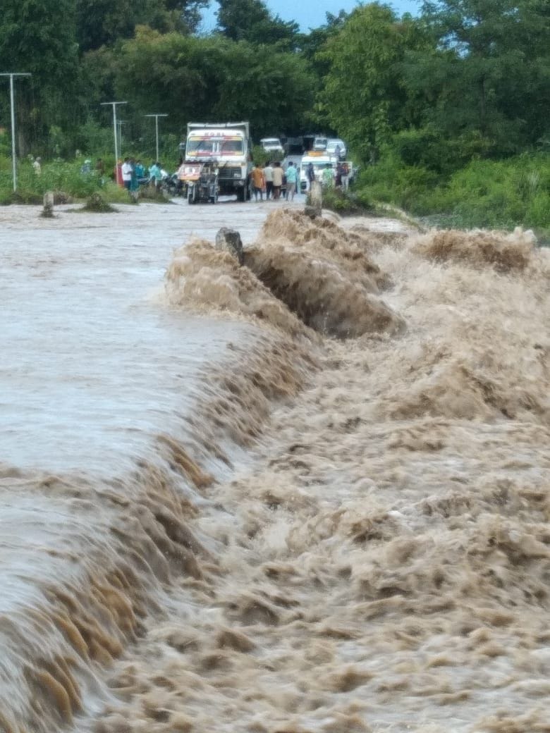 Rish overflowing drains blocked the road to Purnagiri, passengers stranded for hours
