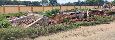 Shops being built on the land of village society were demolished by JCB