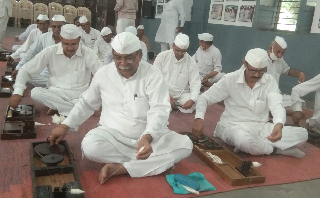 Tribute to Mahatma Gandhi and Shastri by spinning yarn on Charkha