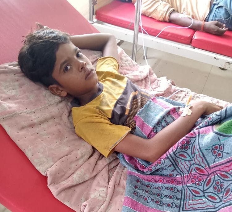Three boys were scorched after being struck by a wire from the top of the school's under-construction building.