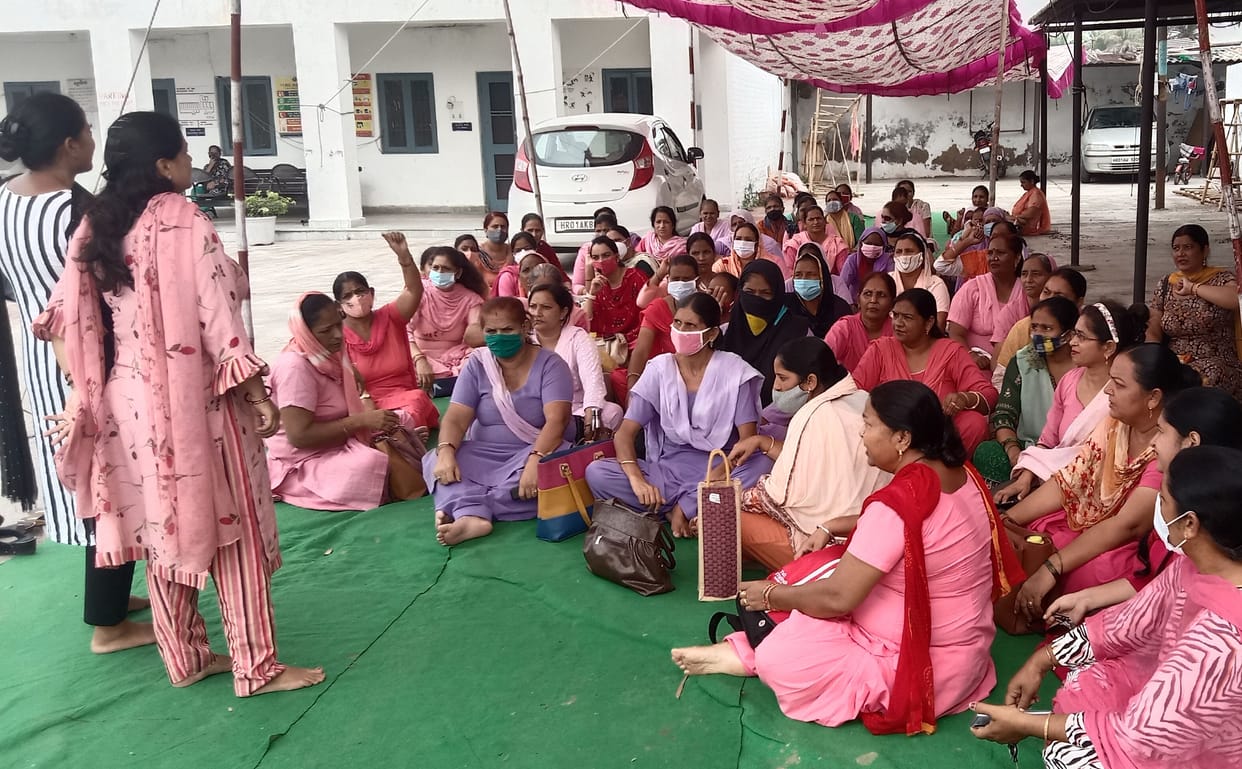 Anganwadi workers protest against the privatization at the office of the Deputy Commissioner