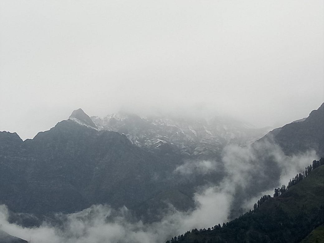 Snowflakes fell on the peaks of Bharmour