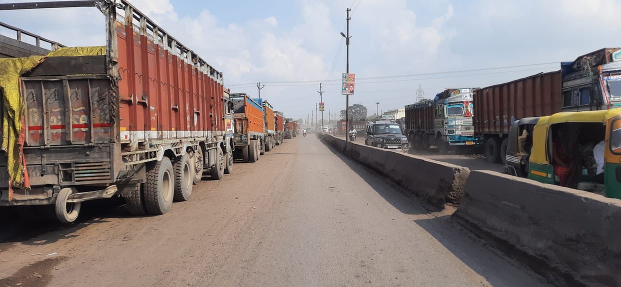 Truck on the road, people's life in breath