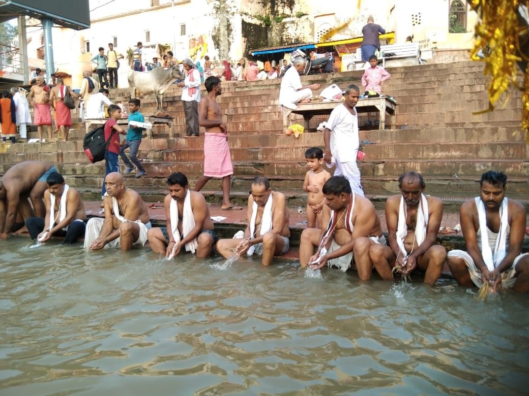 Crowds gathered in Mandakini to offer water to ancestors