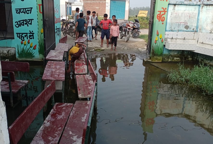 Administration swung into action, got the water filled in the school drained
