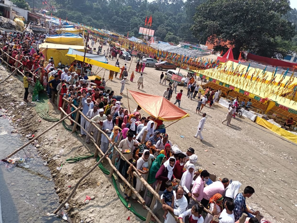 Mother's darshan by standing in long lines