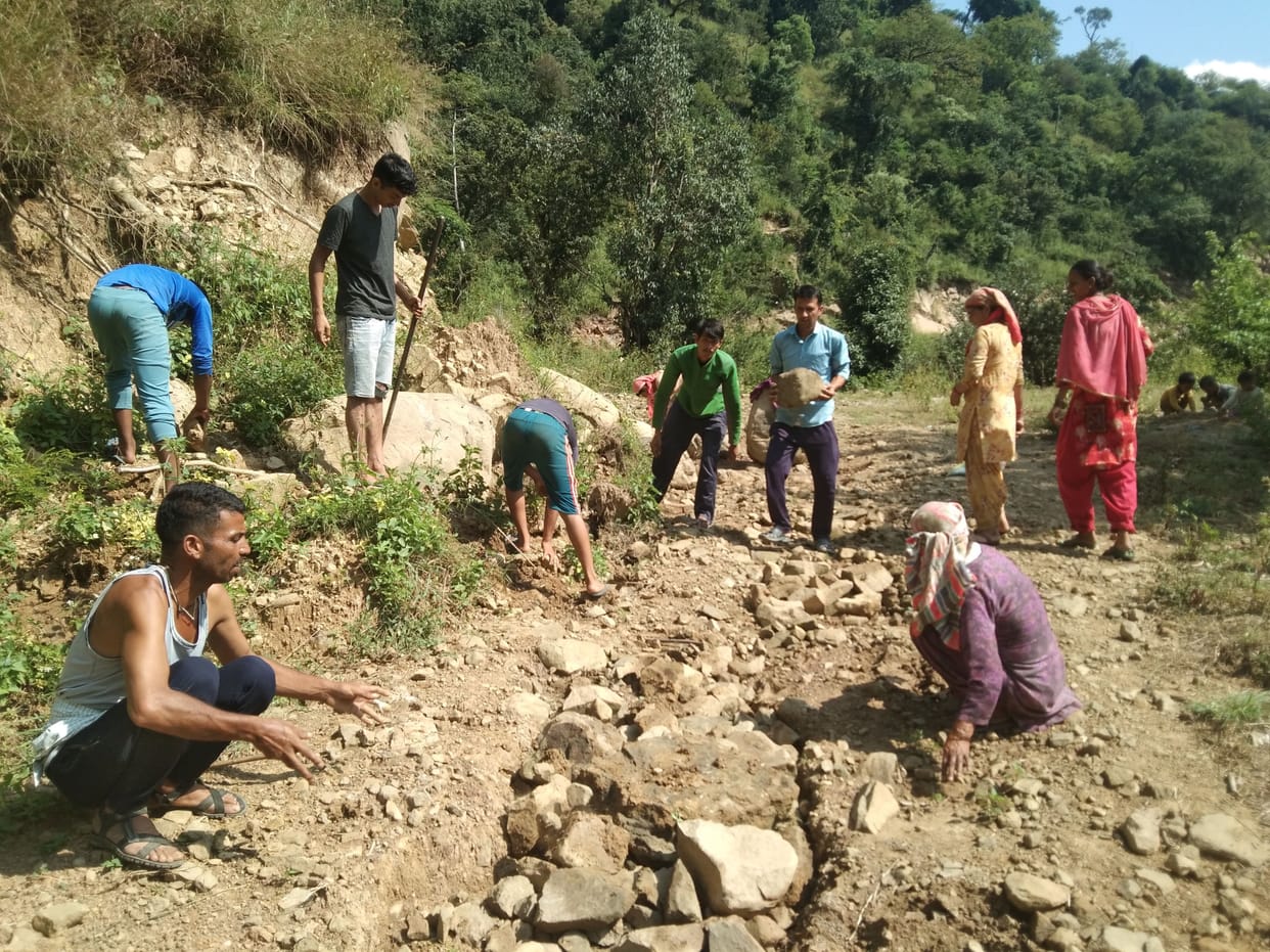 Villagers themselves started to repair the road made of drain