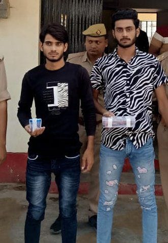 Two attackers who were running away after firing were caught by the police