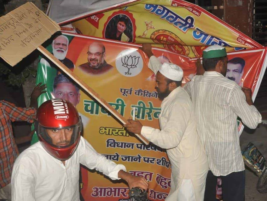 MLC hoardings with photos of PM, CM torn