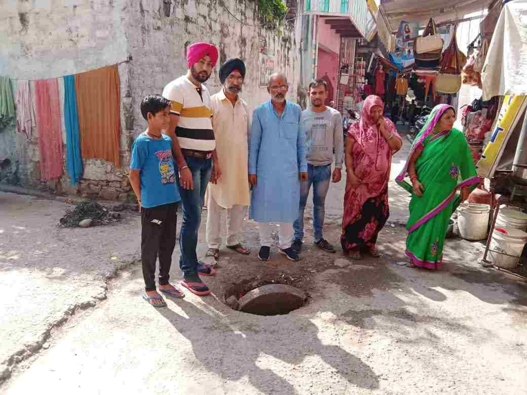 Sewer line manhole cover broken, danger of accident