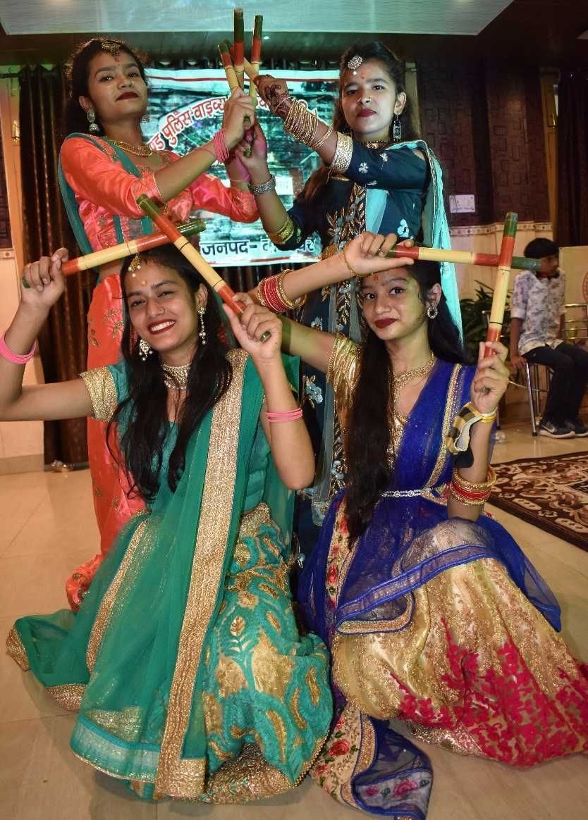 Women of police family scattered colors by dancing dandiya