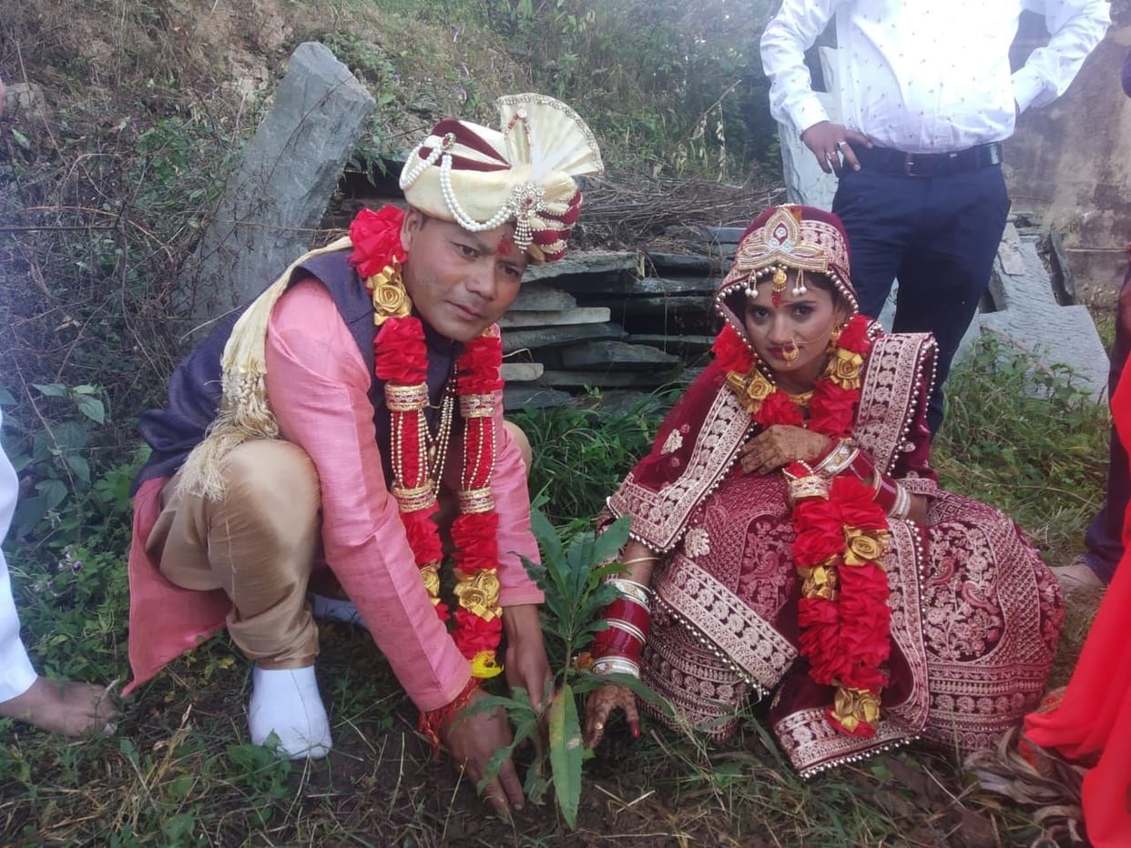 The bride and groom planted a plant