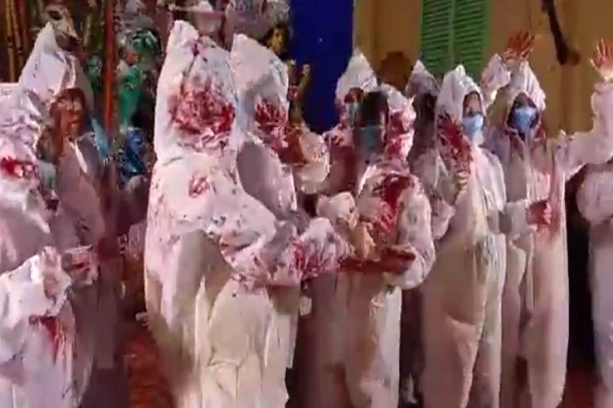 Hindu and Muslim women participate in sindur khela wearing PPE kits in Kolkata pandal