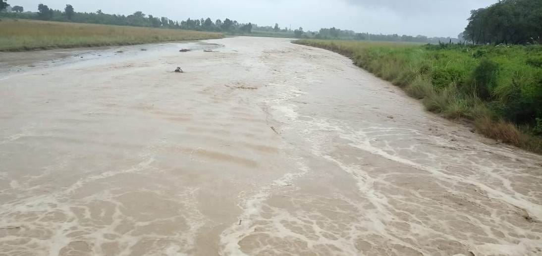 Seasonal river due to rain, drains overflow