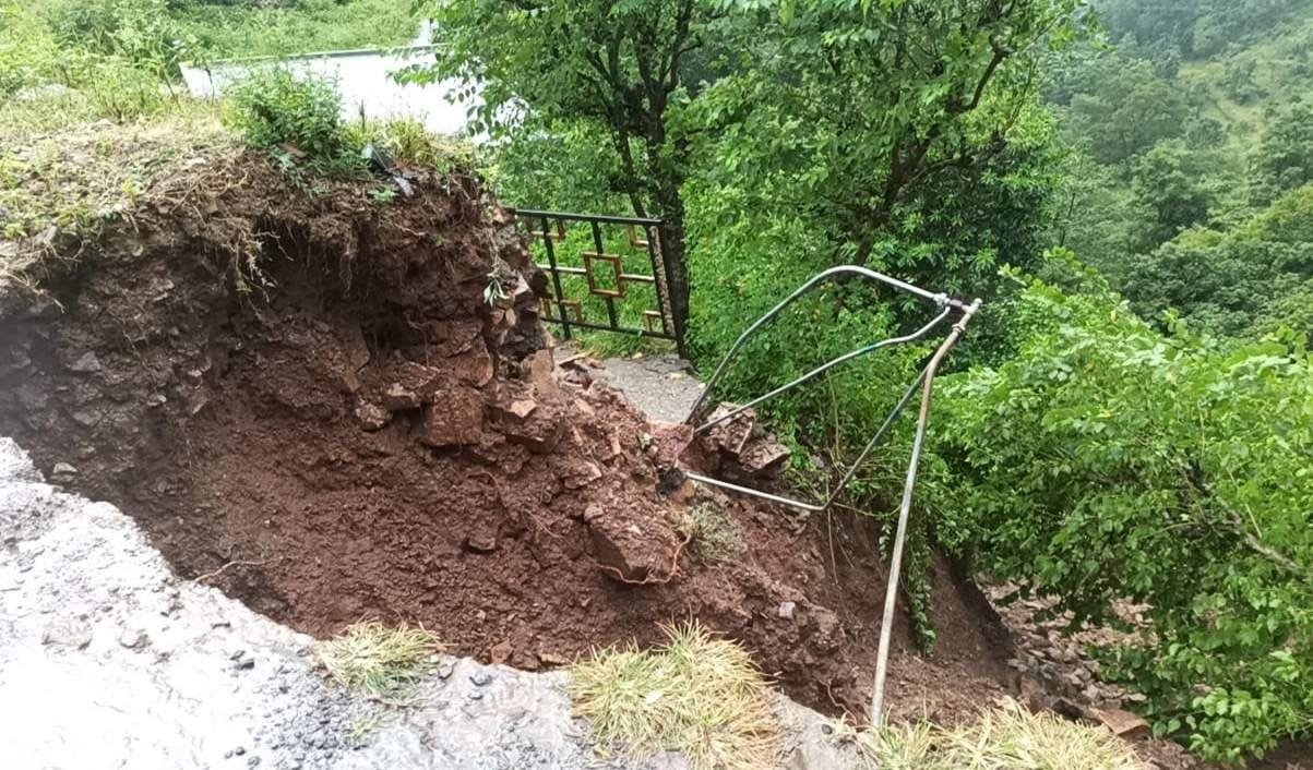 Road and courtyard of house damaged in Chai village