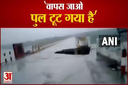 Uttarakhand Locals present at a bridge over Gaula River in Haldwani shout to alert a motorcycle rider who was coming towards their side by crossing the bridge that was getting washed away due to rise in water level
