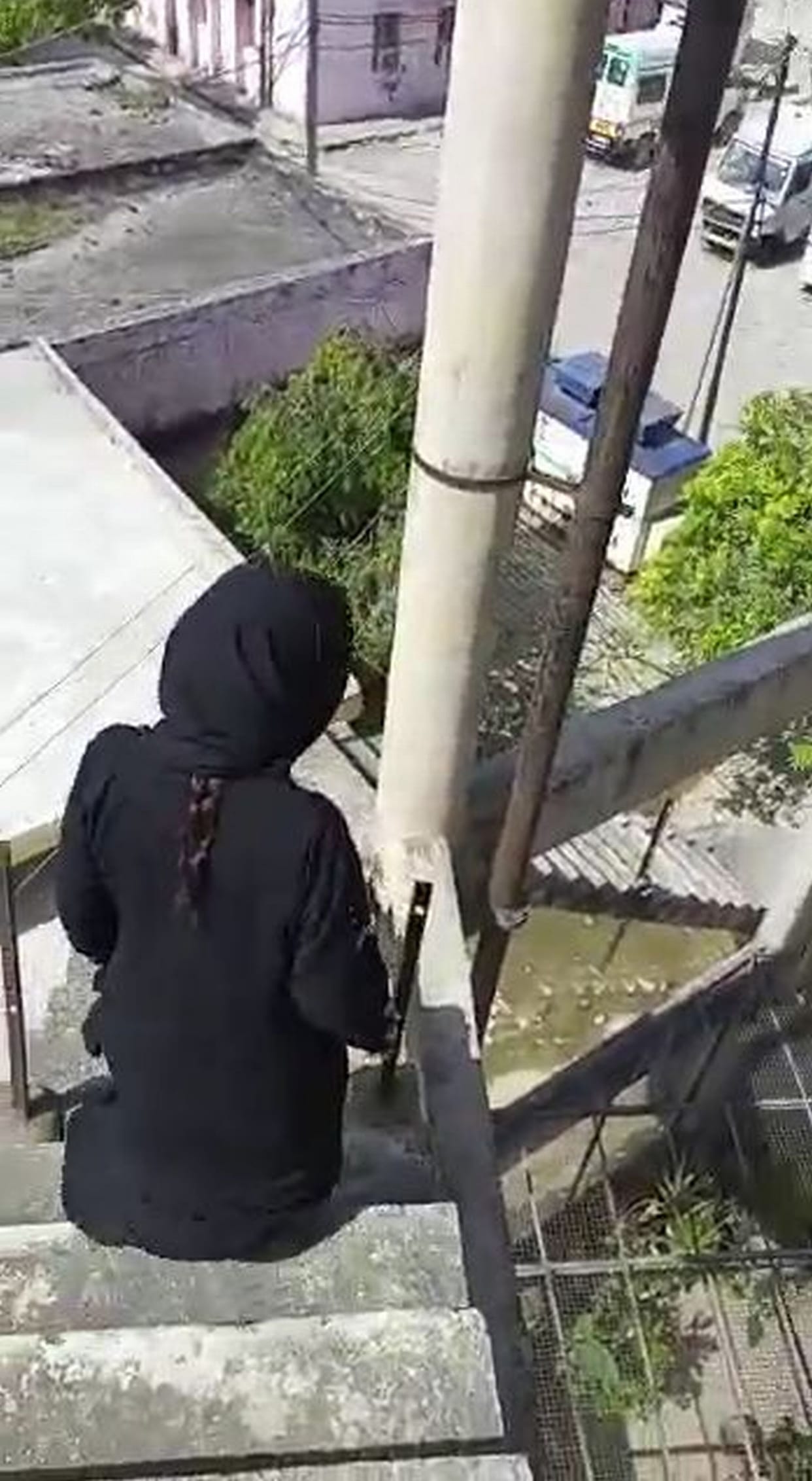 Woman climbs on water tank in women's hospital