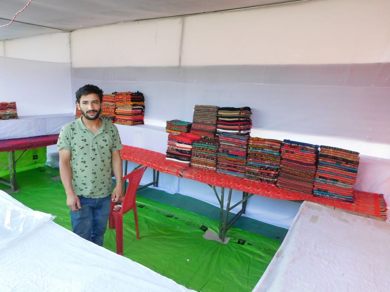 Shops adorned with Kashmiri shawls and Banarasi sarees