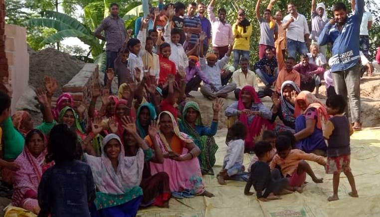 Women sitting on dharna against police