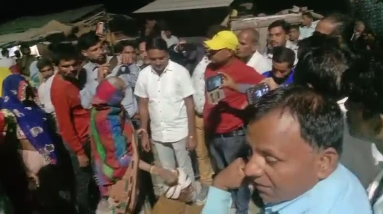In Makdoompur, the family members of the girl sitting on the road
