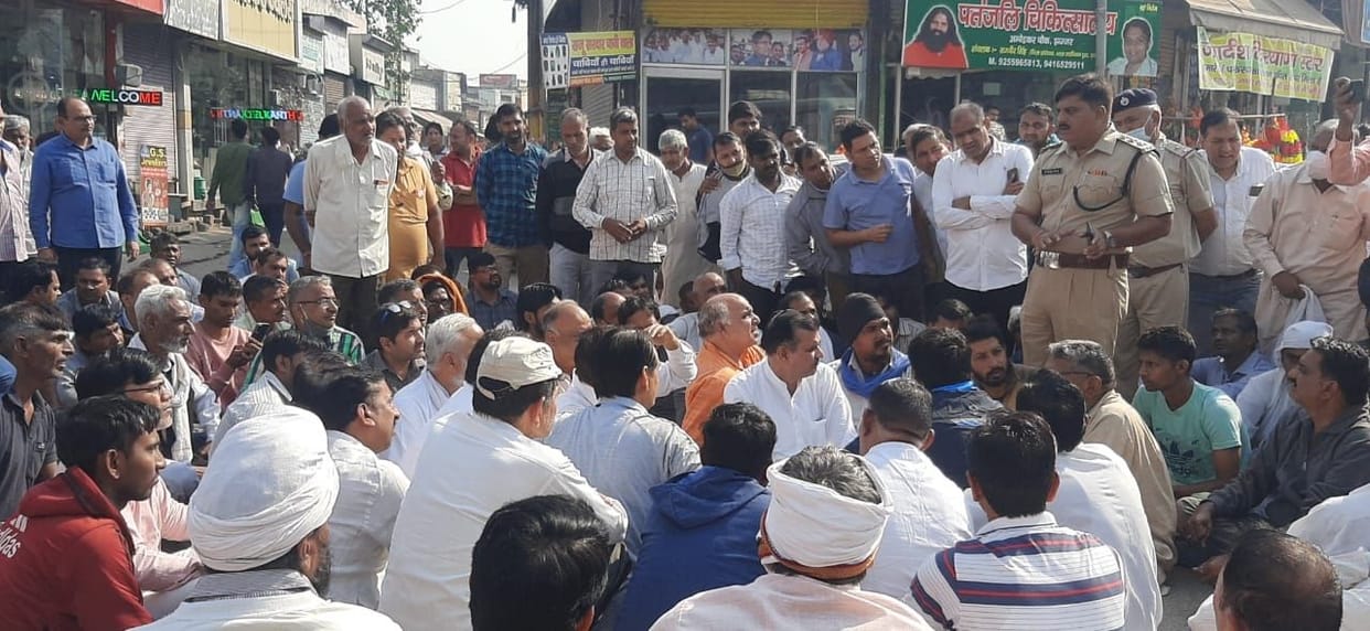 Angry traders staged a protest over the murder of the young man