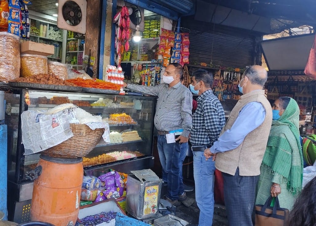 Destroyed spoiled sweets, oil and rotten fruits