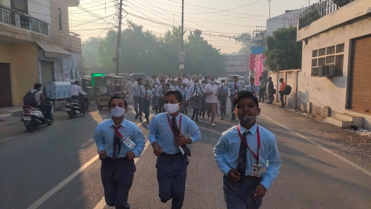 Children and police officers run in Run for Unity