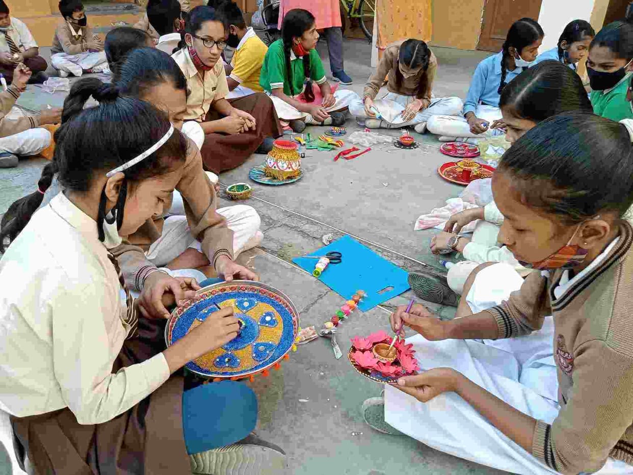 Children showed talent in the decoration of Diya, Kalash