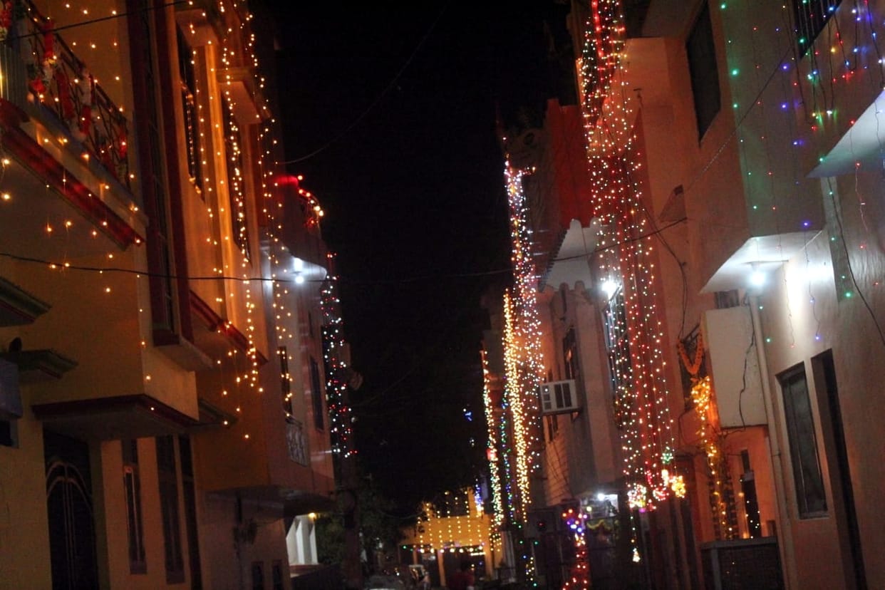 Diwali today, the house-courtyard lit with colorful fringes