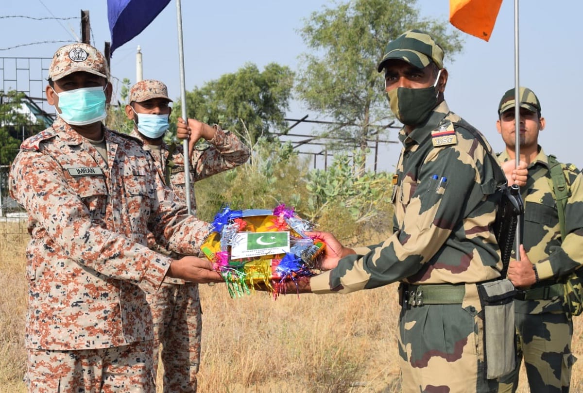 Border Security Force and Pakistan Rangers exchange sweets at Attari-Wagah border on occasion of Diwali