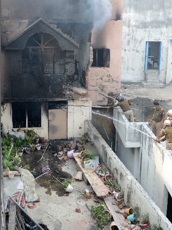 Family engulfed in fierce fire in three-storey building, woman dies