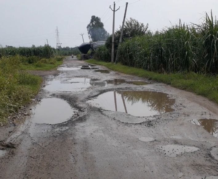 Pity: Pits in one and a half km long road