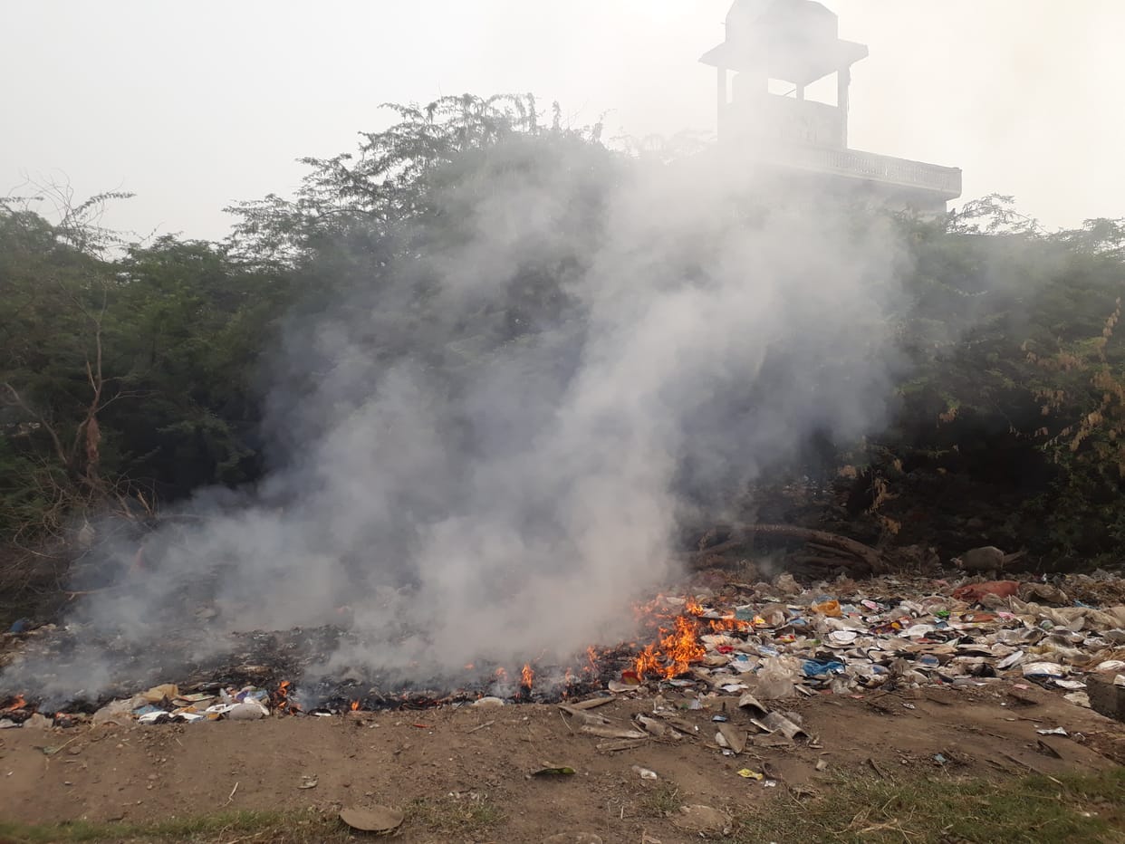 The increasing pollution in the city due to burning of garbage in the open