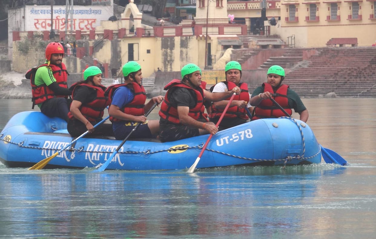 Tourists enjoy rafting in Tirthnagari