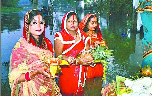Standing in water, women offered Arghya to the setting sun