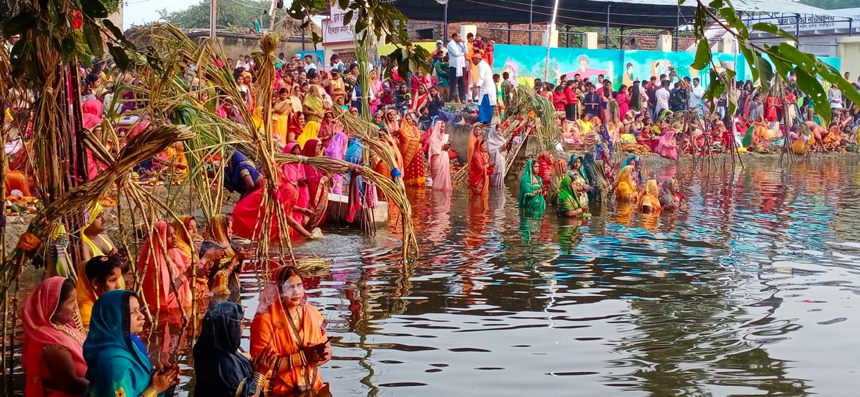 The fasting women prayed for happiness and prosperity by offering arghya to the rising sun.