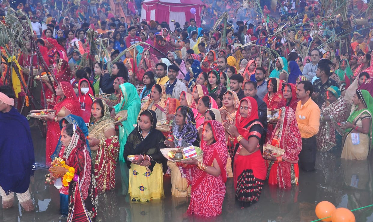Floods gathered on the ghats to offer arghya to the rising sun