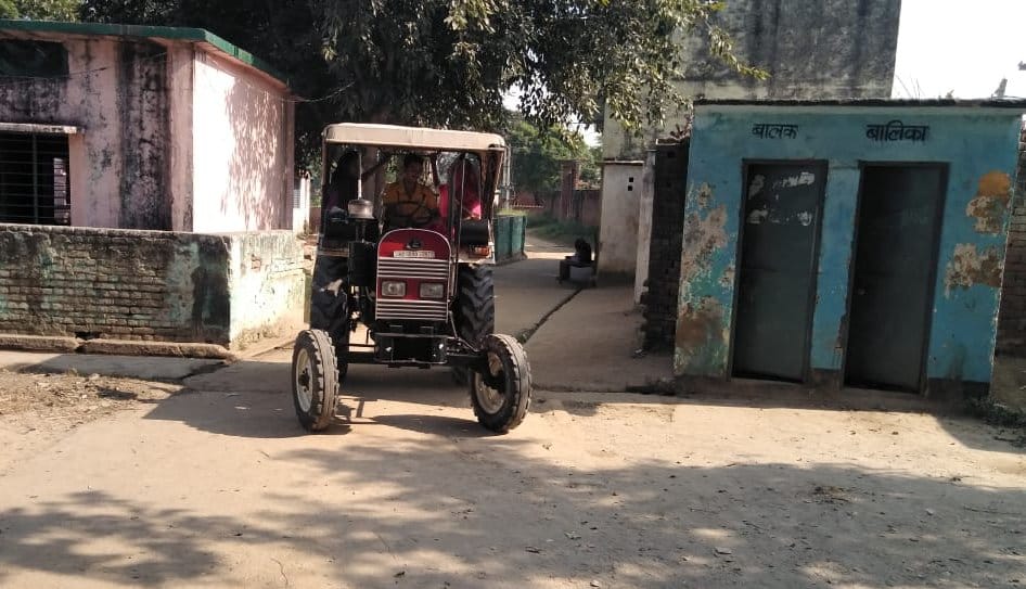 Villagers pass fast on vehicles from school premises