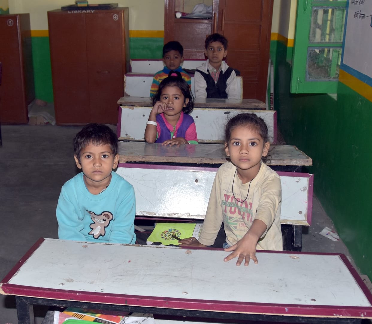 Students reaching school chilling without sweaters and shoes
