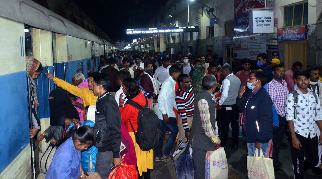 Crowd gathered in roadways buses and trains