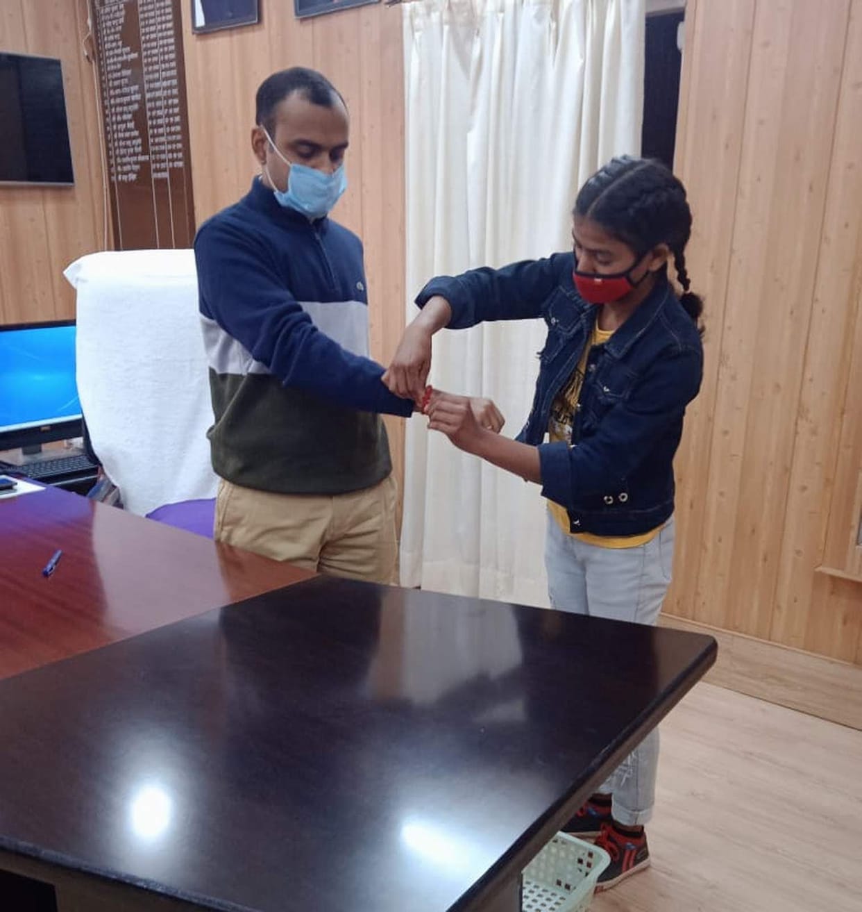 Pledge to protect children by tying a protective thread