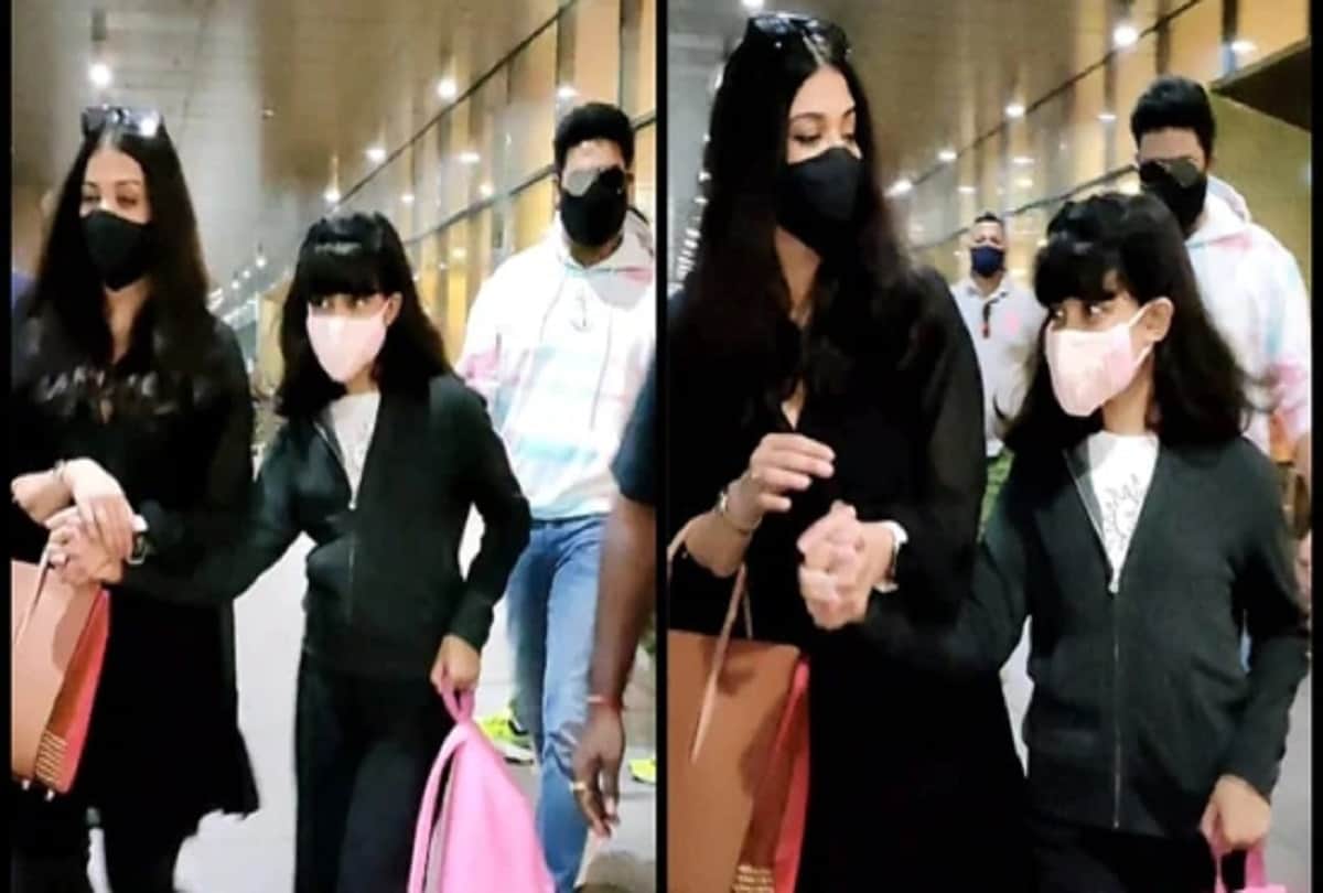 Aishwarya Bachchan holds Aaradhya’s hand Abhishek waves paparazzi at airport