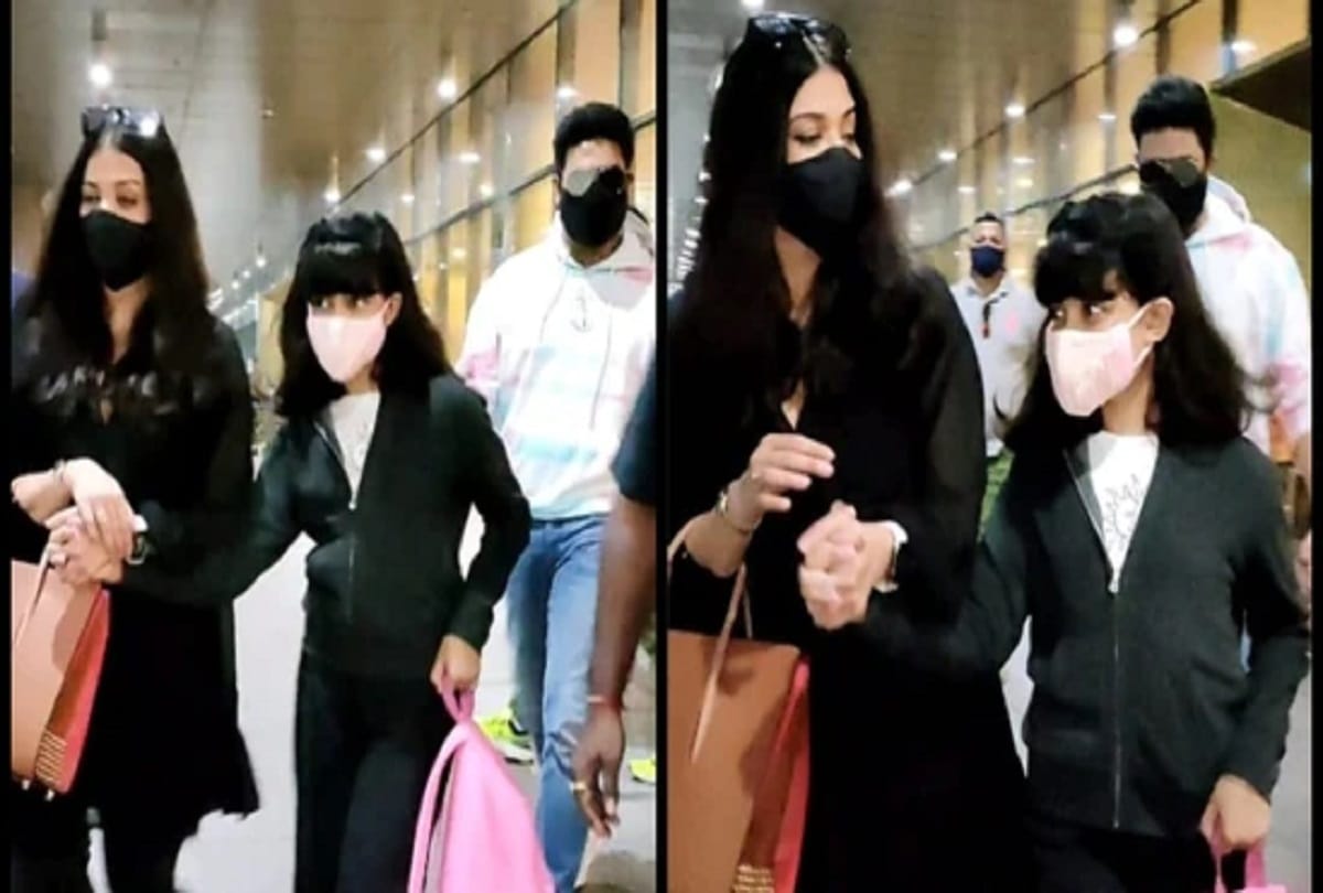 Aishwarya Bachchan holds Aaradhya’s hand Abhishek waves paparazzi at airport