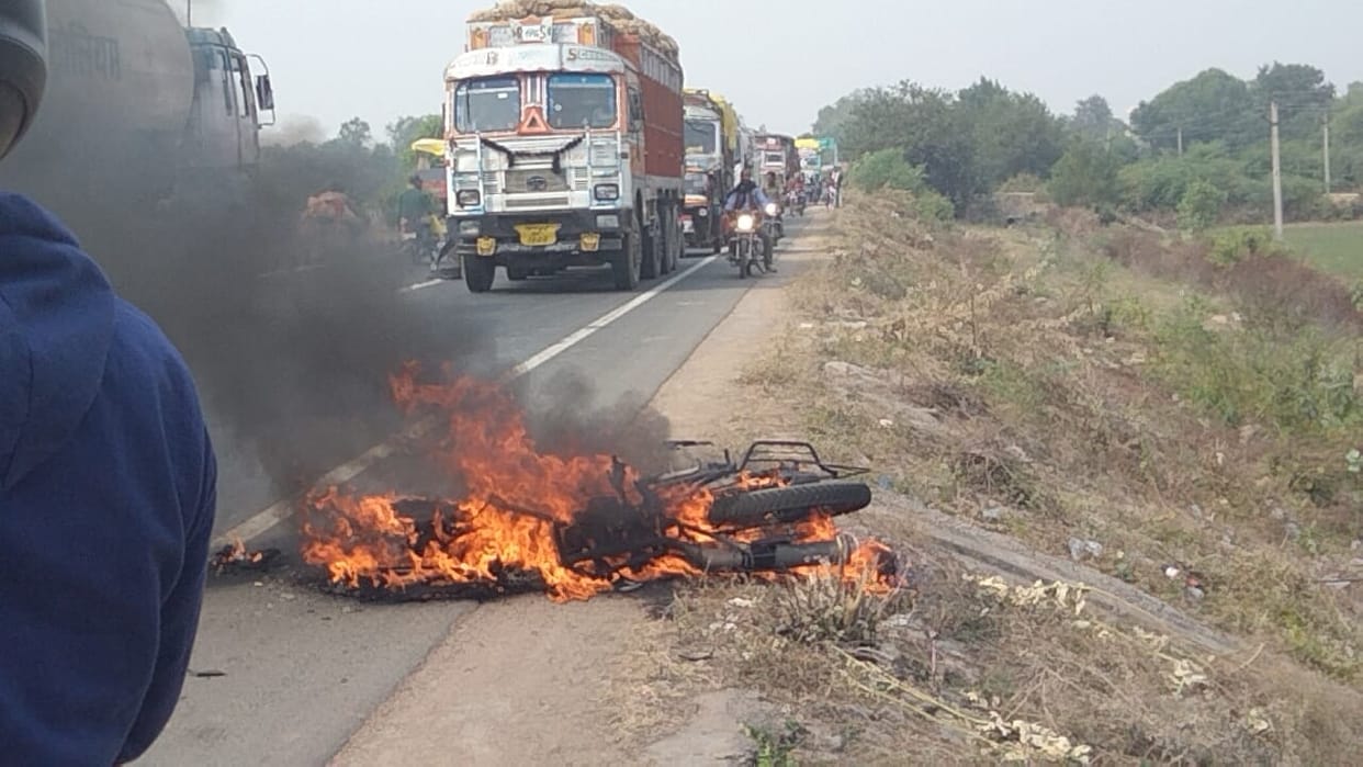 truck hit bike, two injured, bike burned