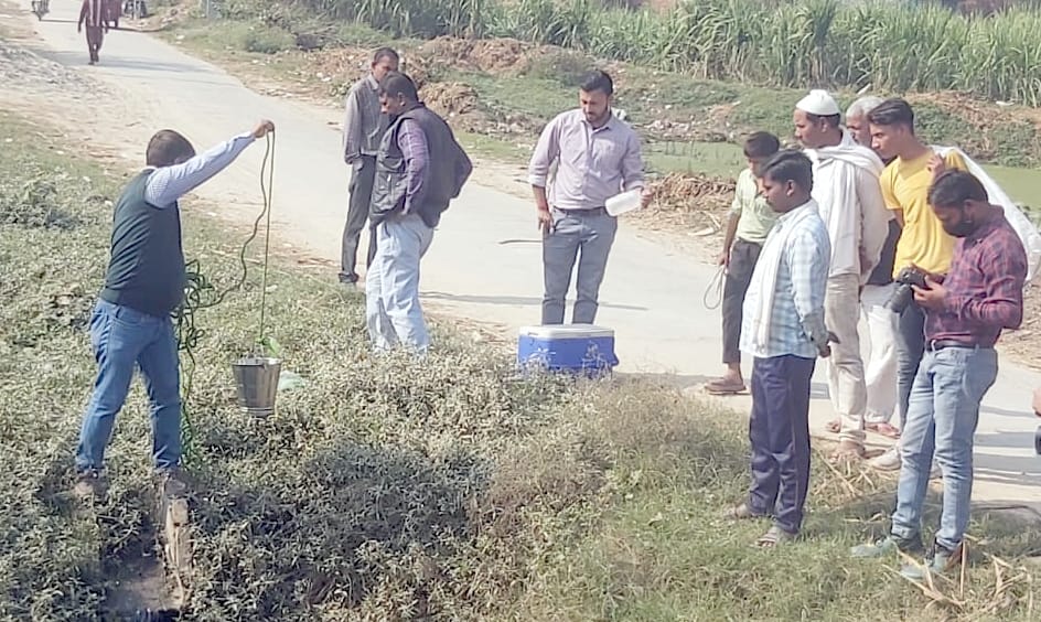 Team samples for water in villages around sugar mill