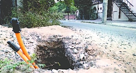The dug pits were left open to lay the PNG line.